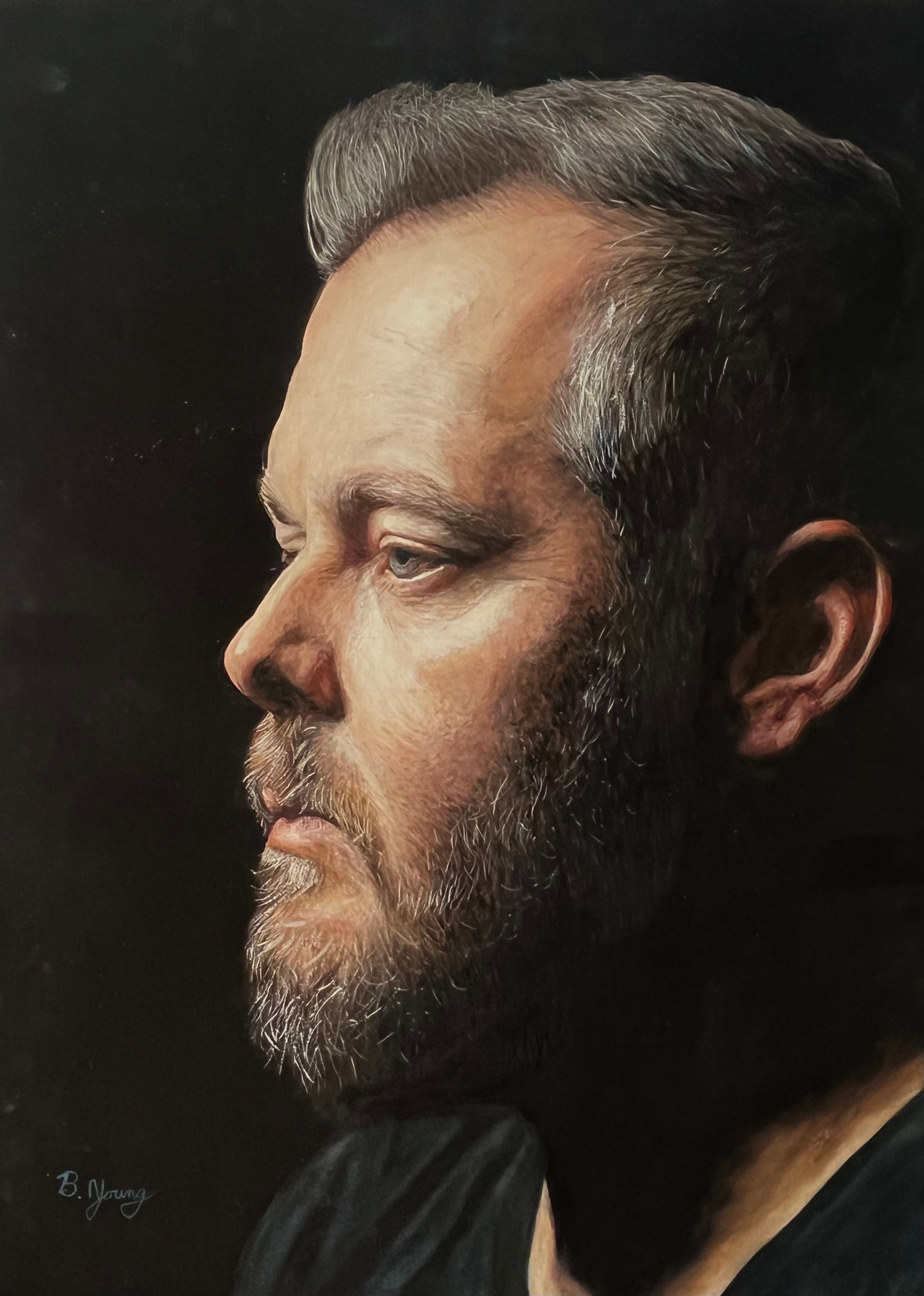 A contemplative side-profile portrait rendered in richly detailed watercolor, capturing quiet strength through dramatic light, shadow, and lifelike realism.