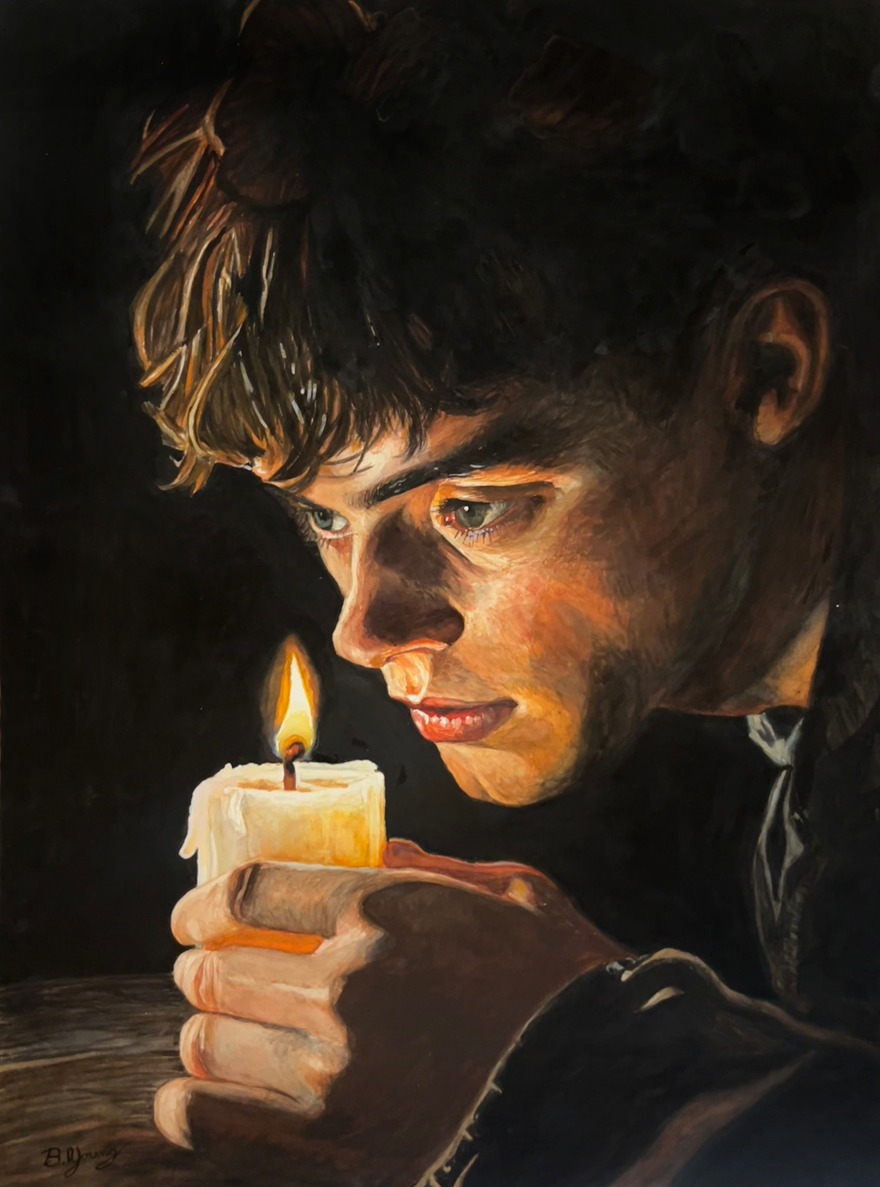 A young man gazes intently at a flickering candle, his face illuminated by its warm glow in a powerful study of light, focus, and introspection.