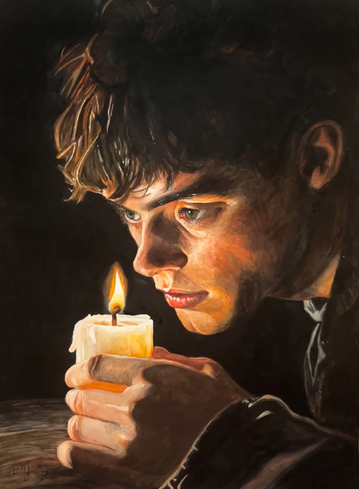 In The Dark (2025) by Ben Young A young man gazes intently at a flickering candle, his face illuminated by its warm glow in a powerful study of light, focus, and introspection.