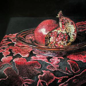 This painting by Ben Young is a still life oil painting of an pomegranate fruit sitting in a metal bowl atop a velvet clothed table.