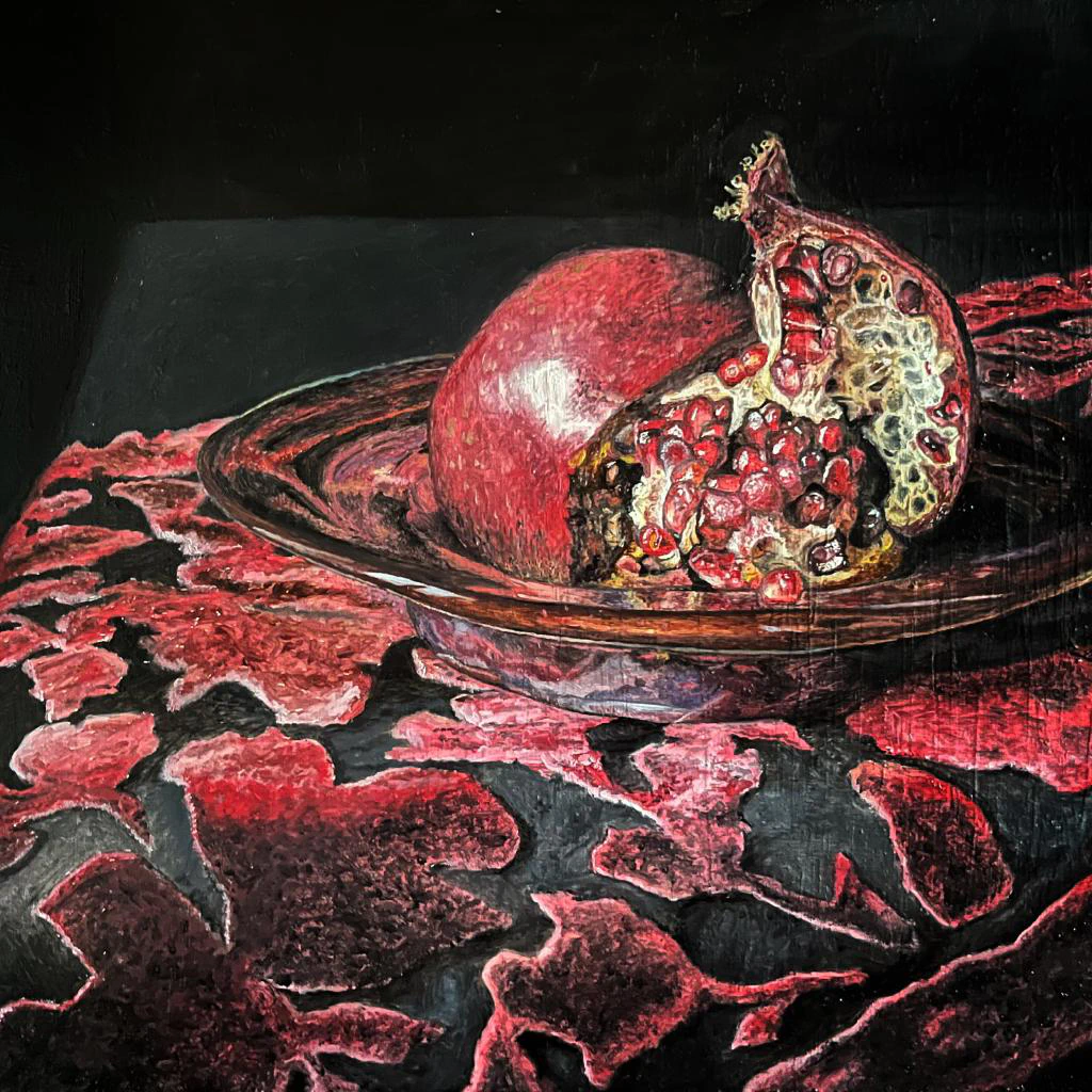 This painting by Ben Young is a still life oil painting of an pomegranate fruit sitting in a metal bowl atop a velvet clothed table.