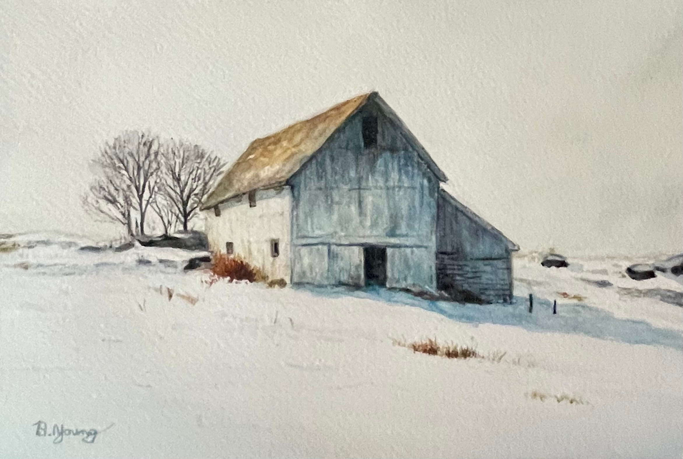 A weathered barn stands as a silent sentinel amidst a vast, snow-covered landscape, captured in soft watercolor washes that emphasize the cool blue shadows of a quiet winter day.