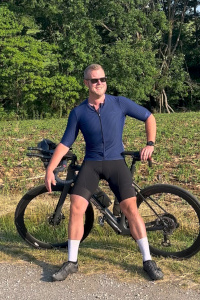 Ben posing with his bicycle